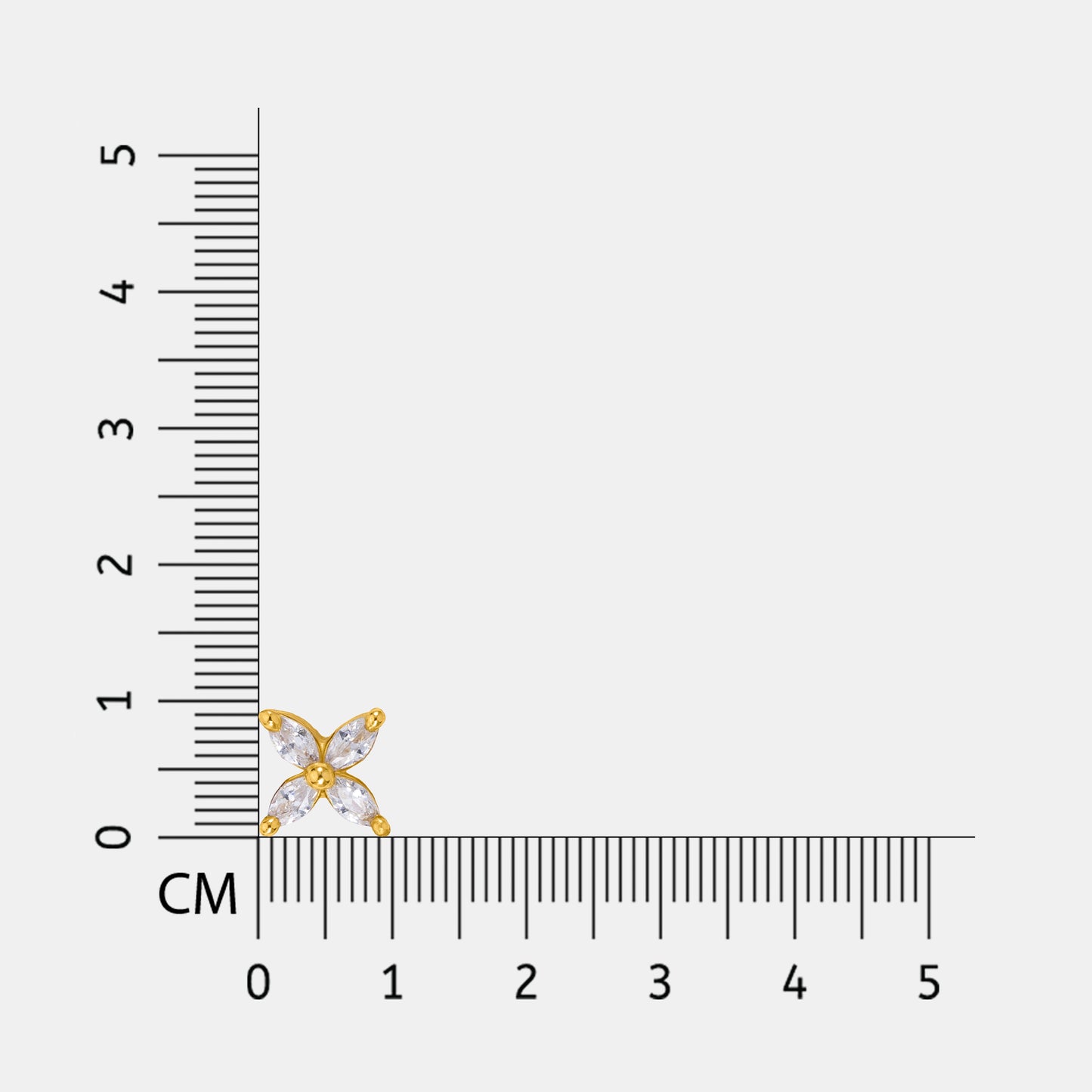 18k gold plated and silver earring next to a ruler on a white background