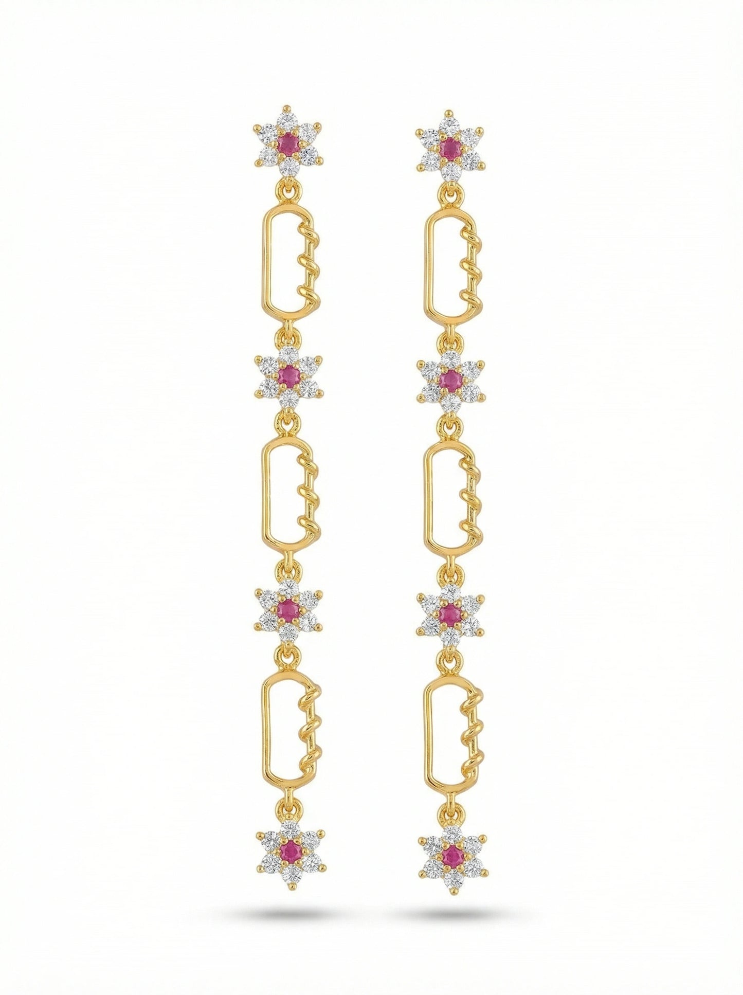 18k gold plated earrings with star-shaped elements and red gemstones on a white background