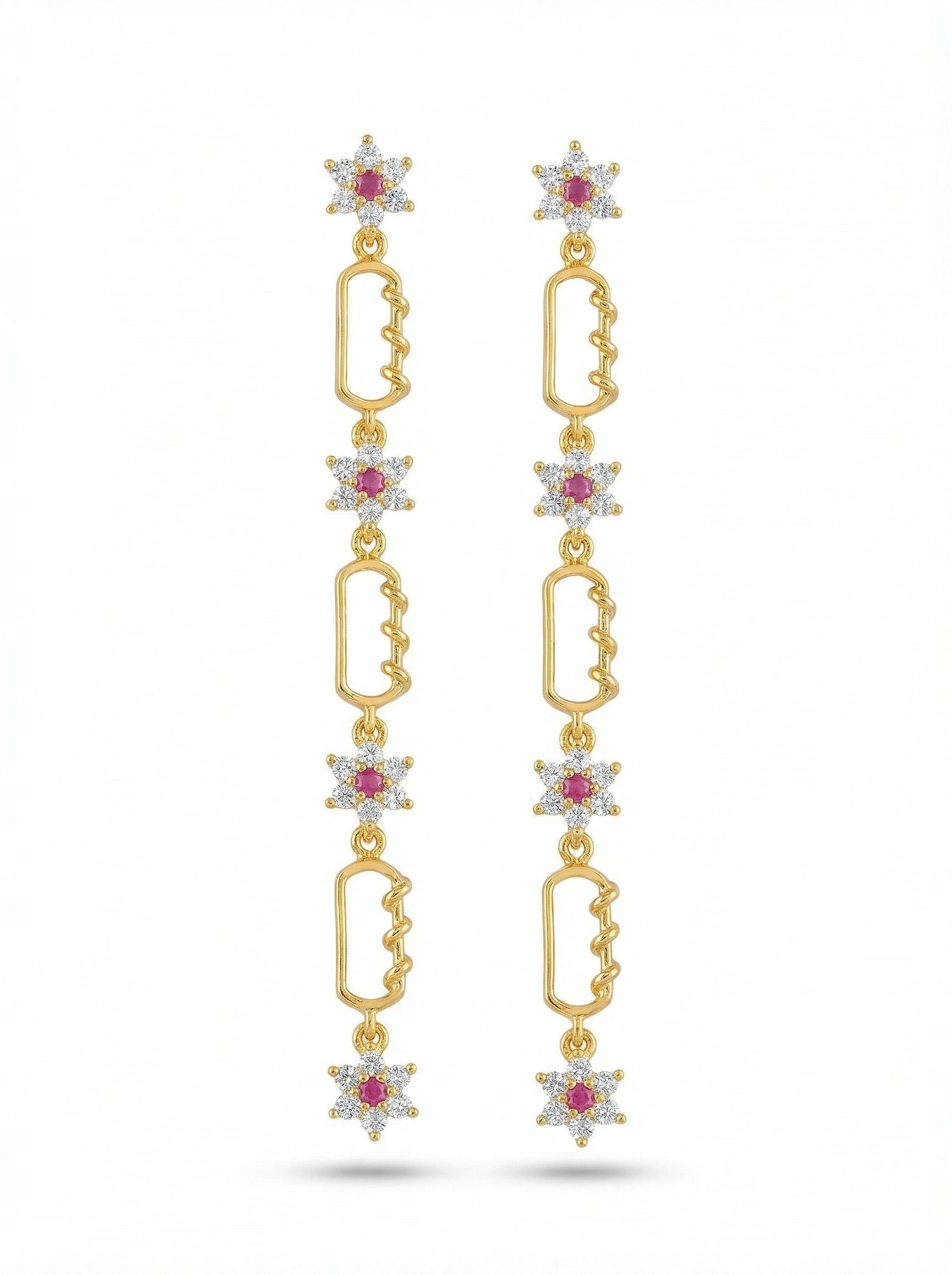 18k Gold plated earrings with star-shaped elements and red gemstones on a white background