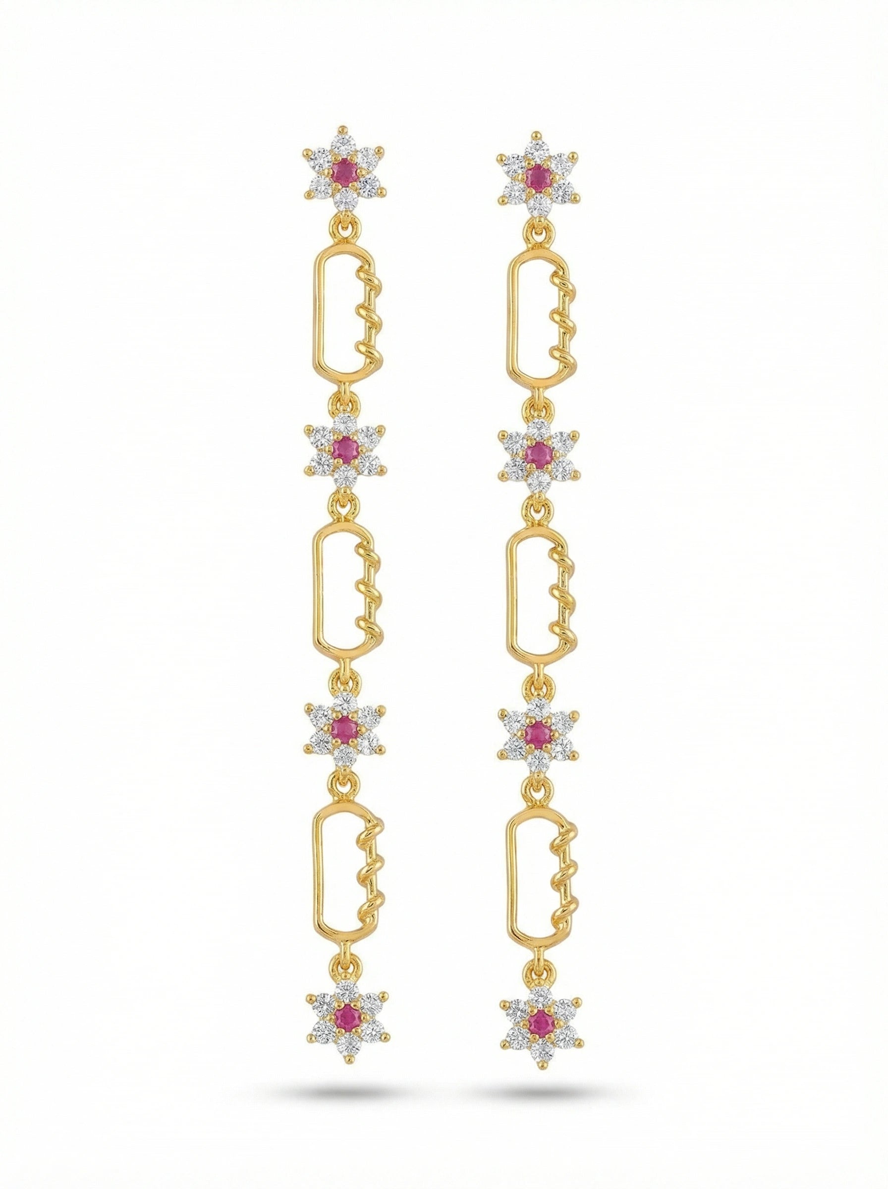 18k Gold plated earrings with star-shaped elements and red gemstones on a white background