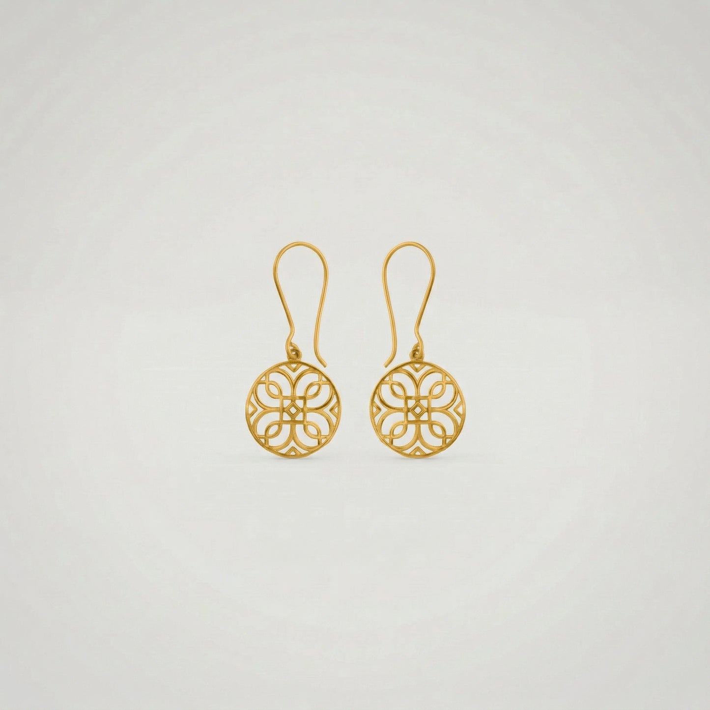 pair of 18k gold plated earrings on a light gray background