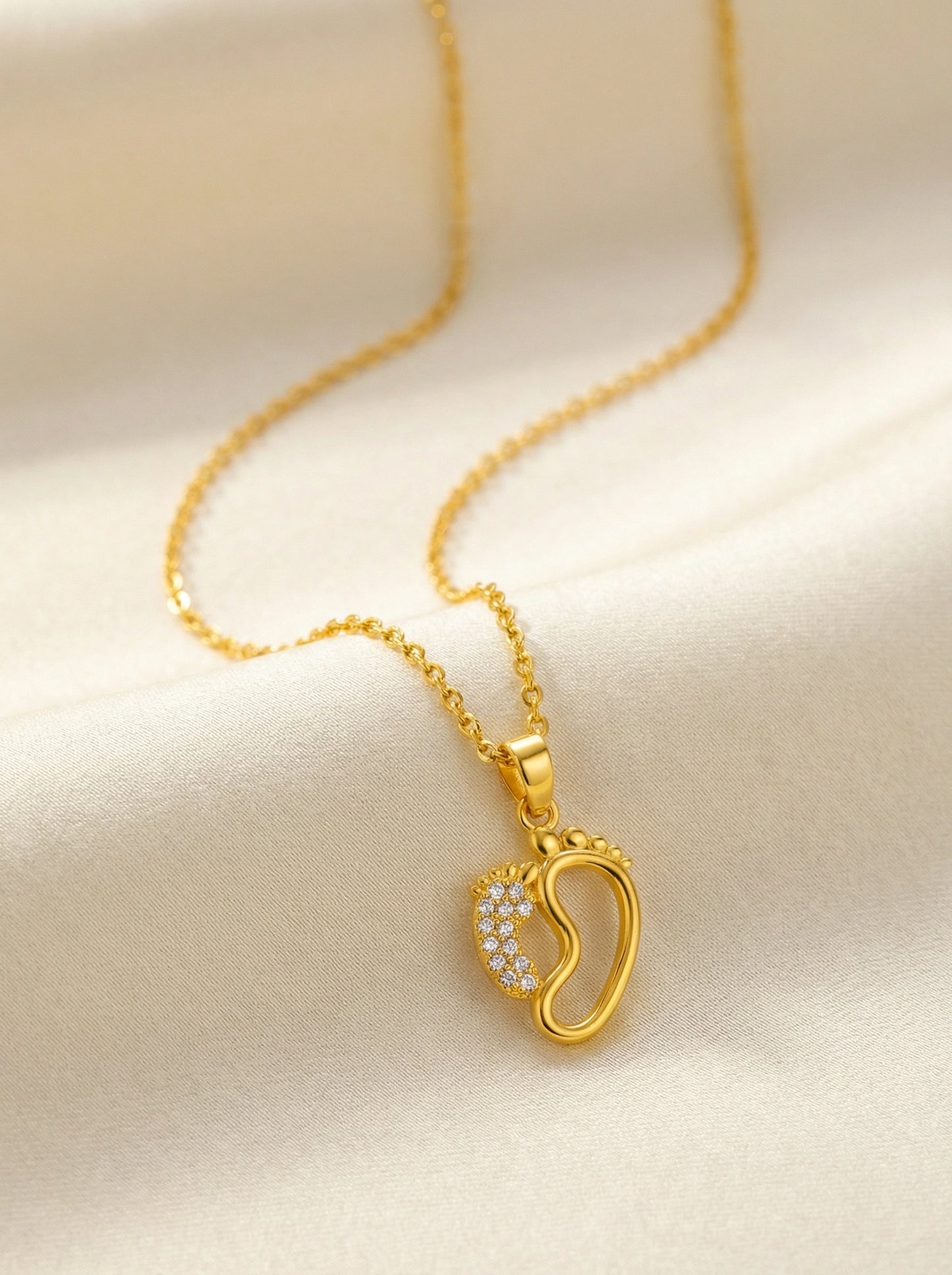 18k gold plated necklace with a heart-shaped pendant on a beige background