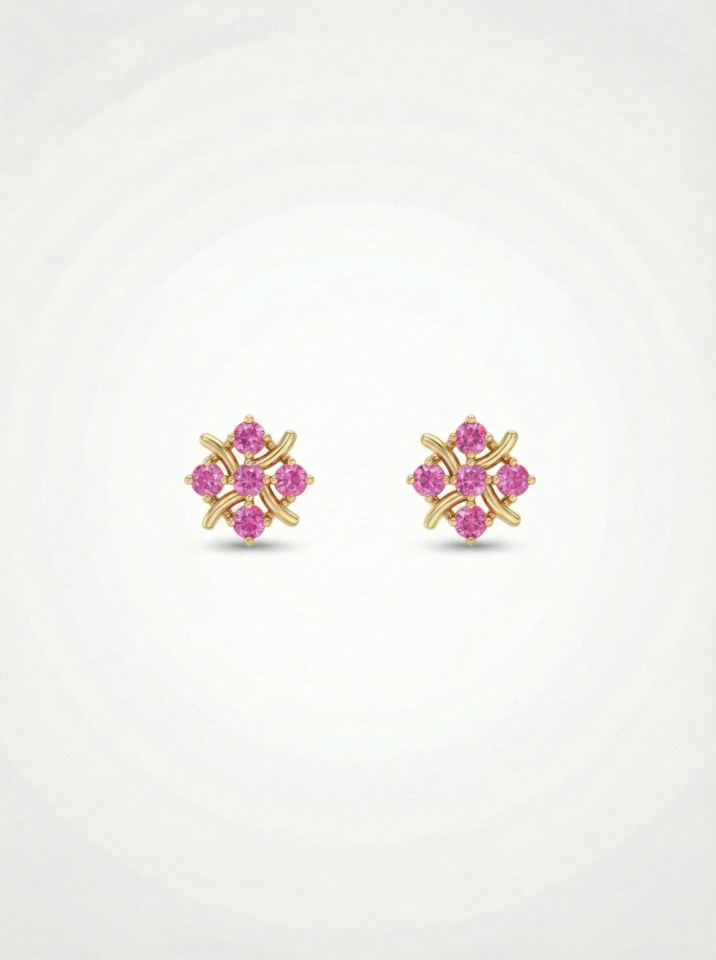 pair of 18k gold plated earrings with pink gemstones on a white  background