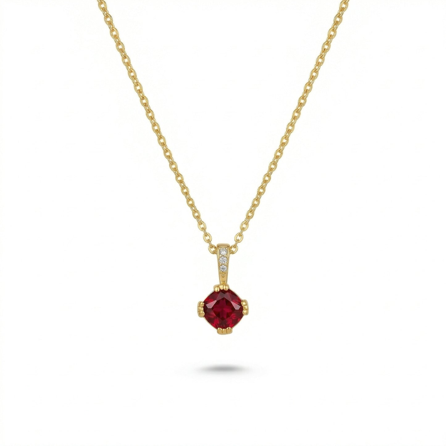 18k gold plated necklace with a red gemstone pendant on a white background