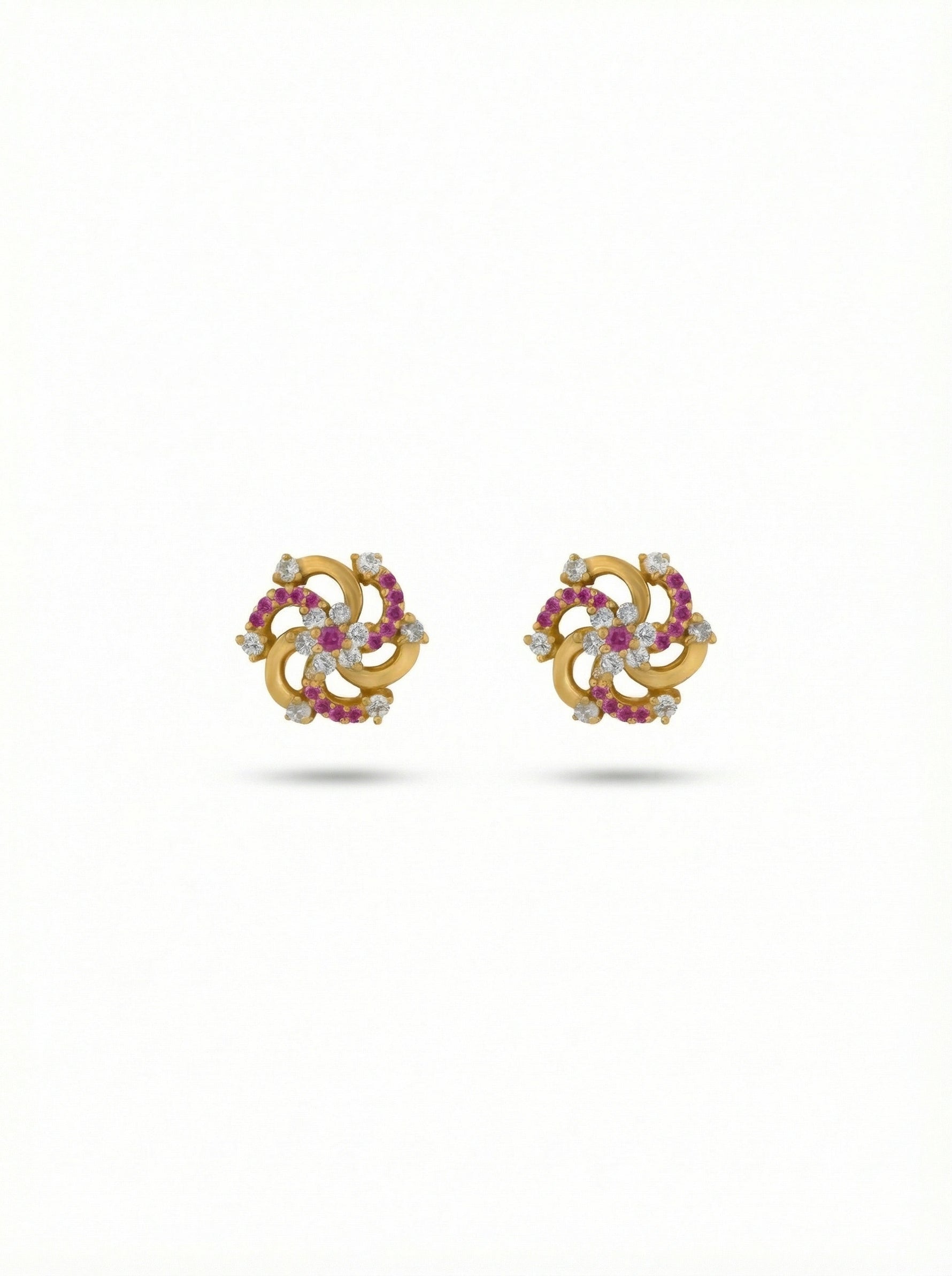 Pair of 18k gold plated earrings with gemstones on a white background