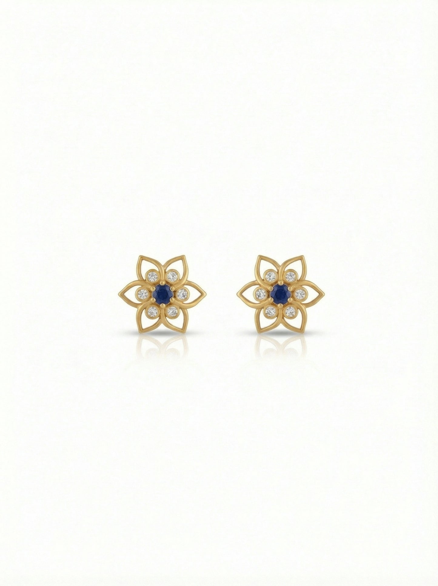 18k gold plated  flower-shaped earrings with blue centers on a white background