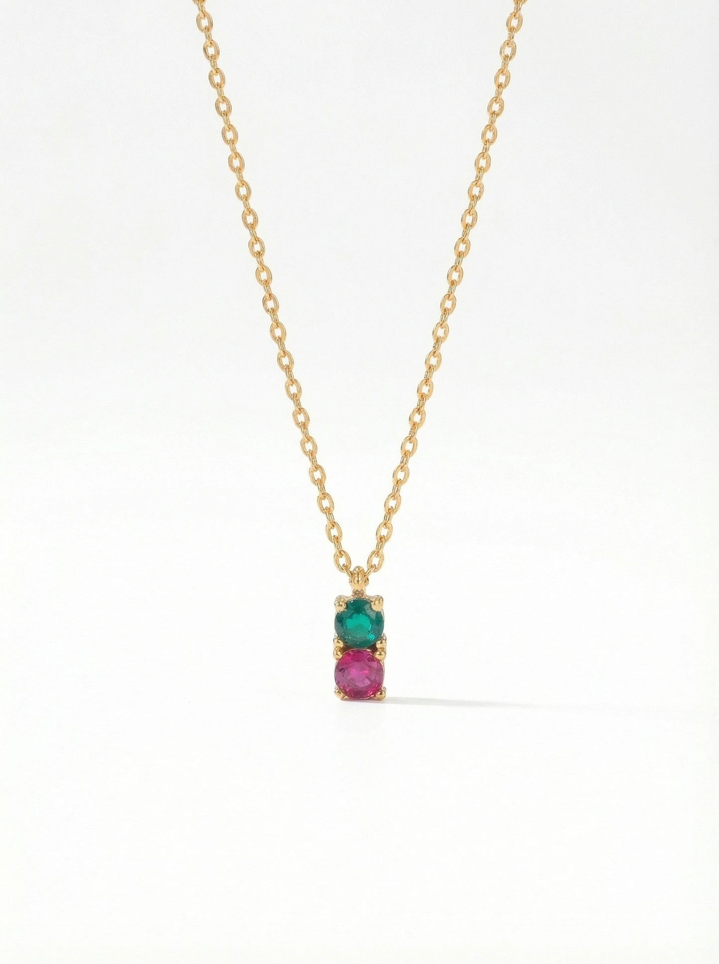 18k gold plated necklace with a pendant featuring a green gemstone and pink stone on a white background