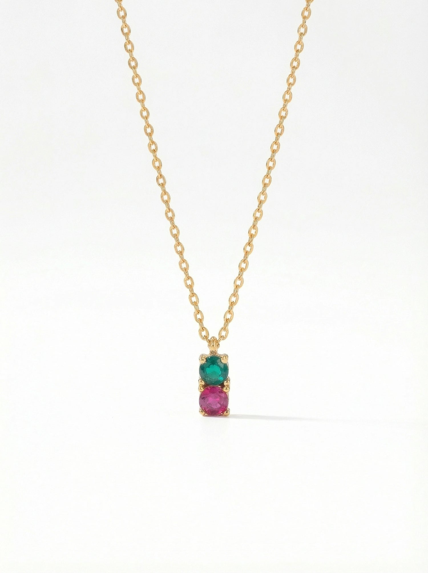 18K Gold PLATED necklace with a pendant featuring a green gemstone and pink stone on a white background