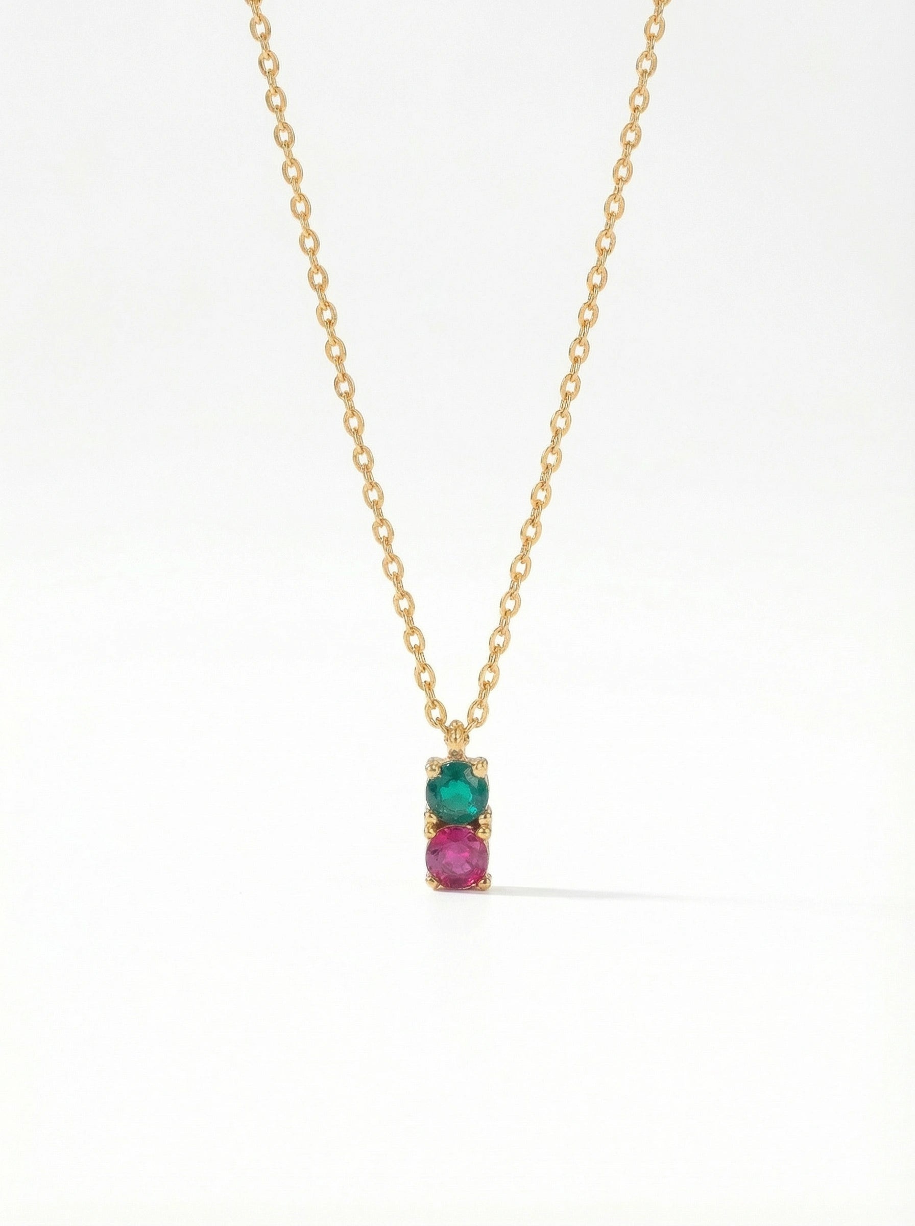 18K Gold PLATED necklace with a pendant featuring a green gemstone and pink stone on a white background
