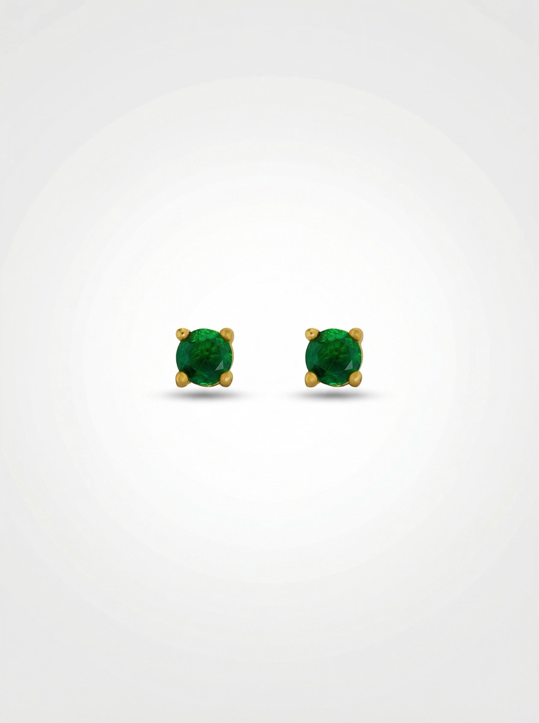 Pair of green gemstone earrings with 18k gold plated settings on a white background