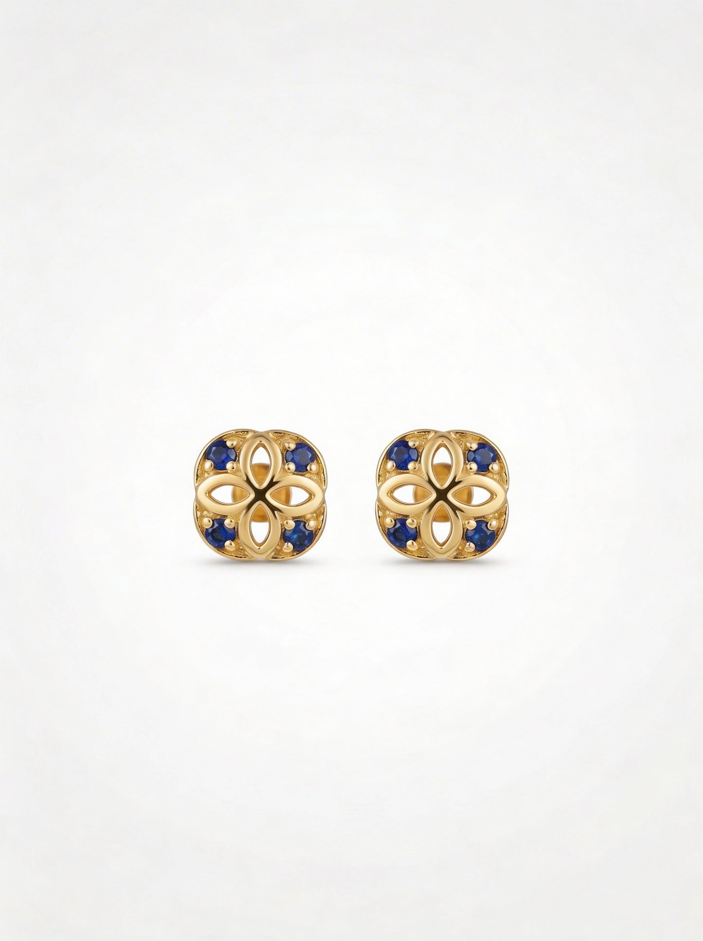 18k gold plated earrings with blue stones on a white background