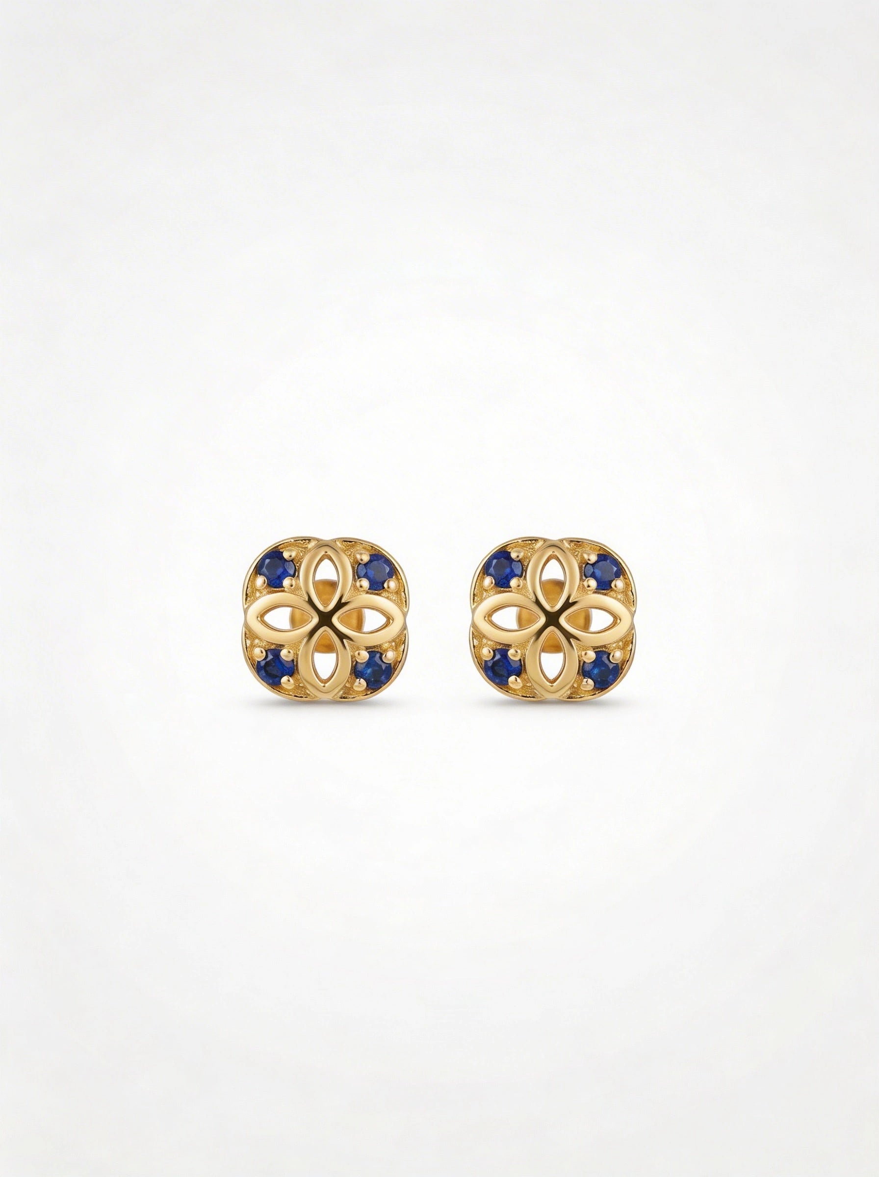 18k Gold plated earrings with blue stones on a white background