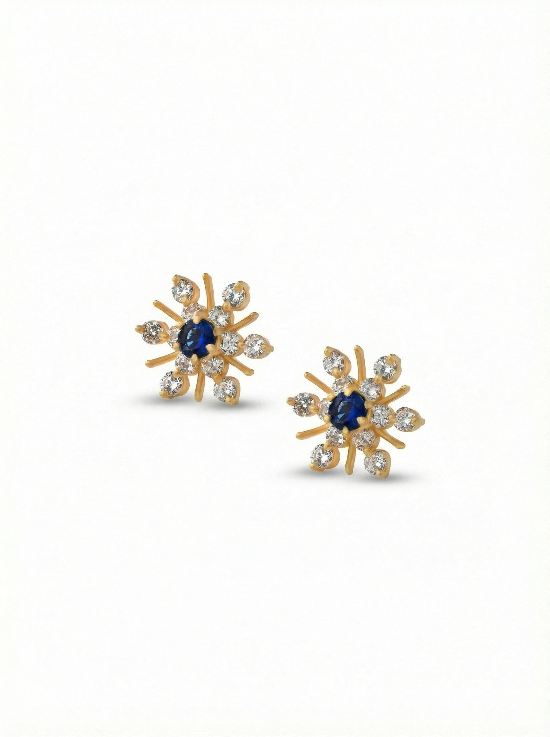 18k Gold plated earrings with blue gemstones on a white background
