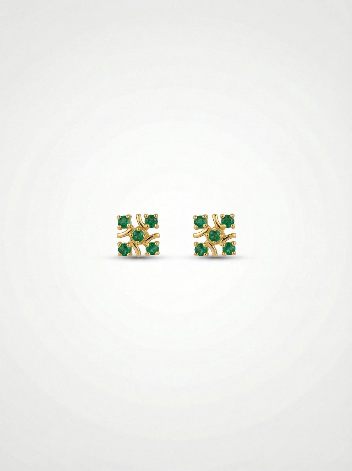 18k gold plated earrings with green gemstones on a white background