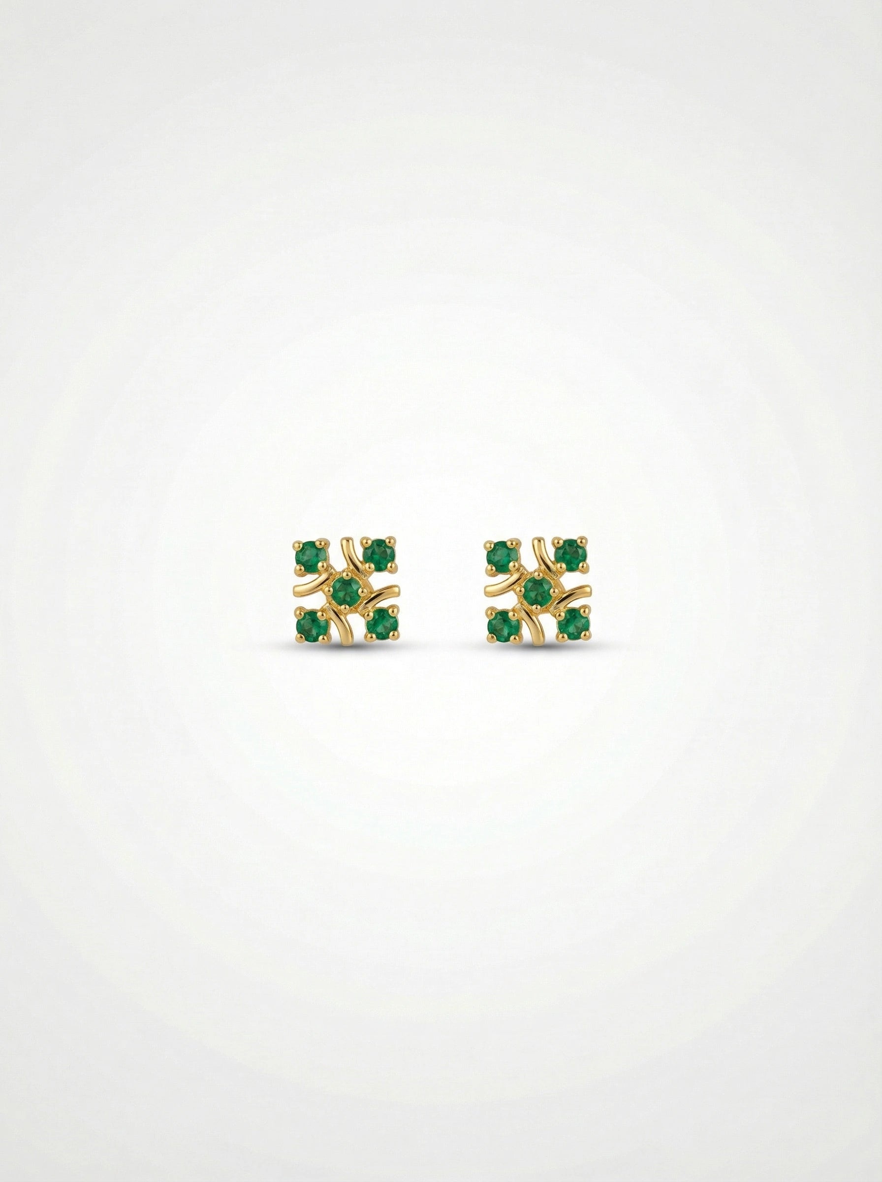 18k gold plated earrings with green gemstones on a white background