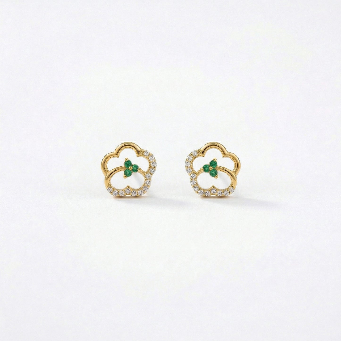 18k gold plated earrings with green gemstones on a white background