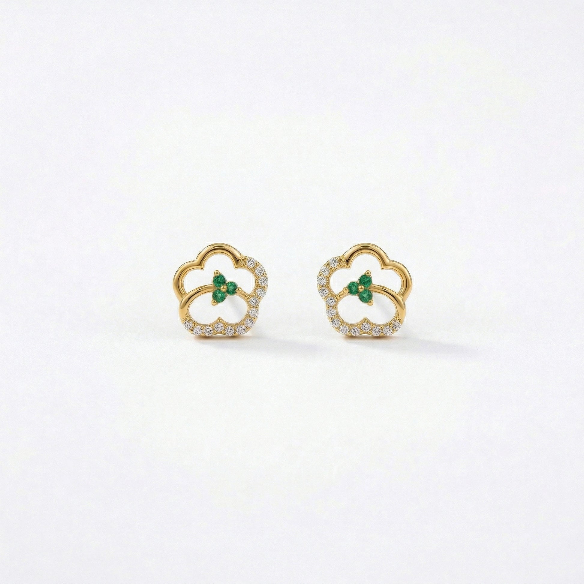 18k Gold plated earrings with green gemstones on a white background