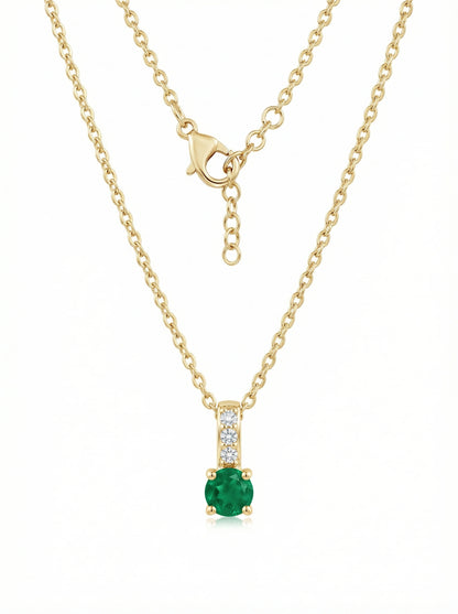 18k Gold plated  necklace with a green gemstone pendant on a white background