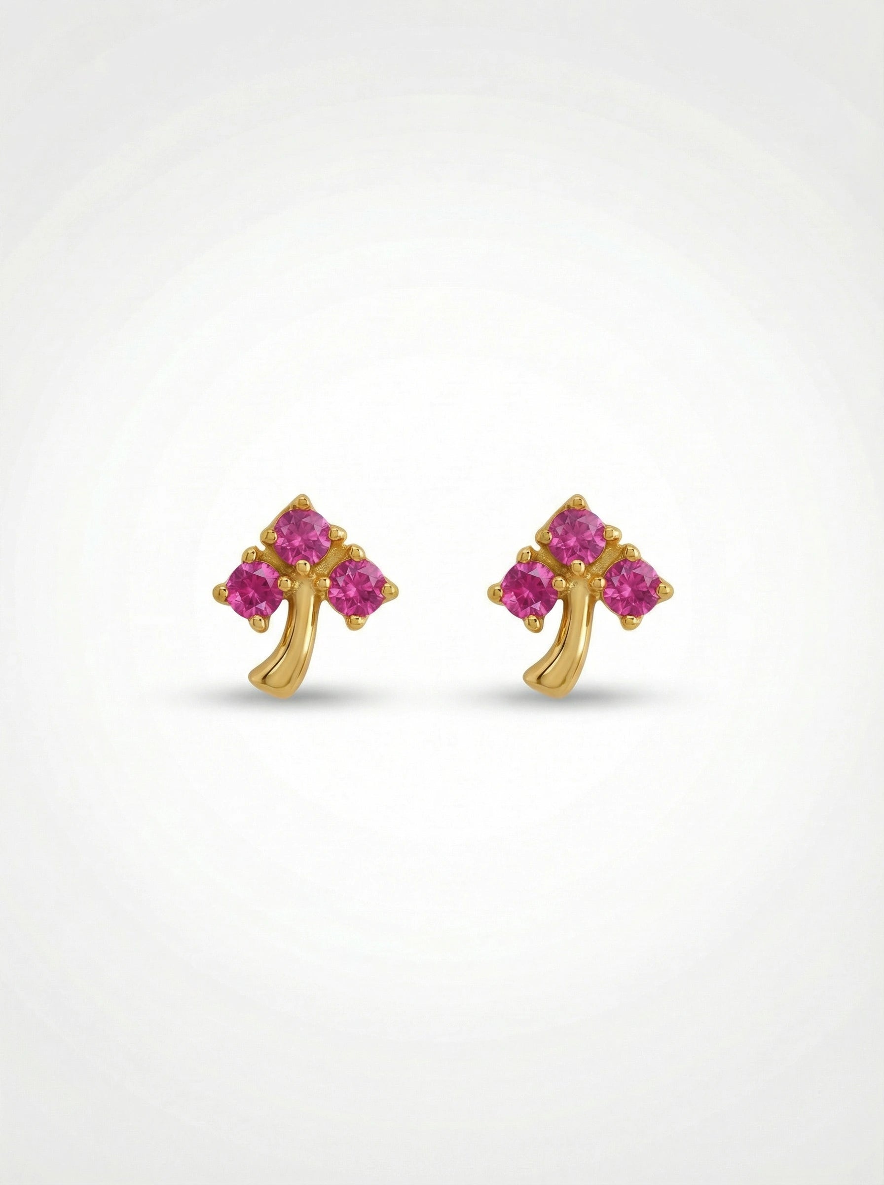 18k Gold plated  earrings with pink gemstones on a white background