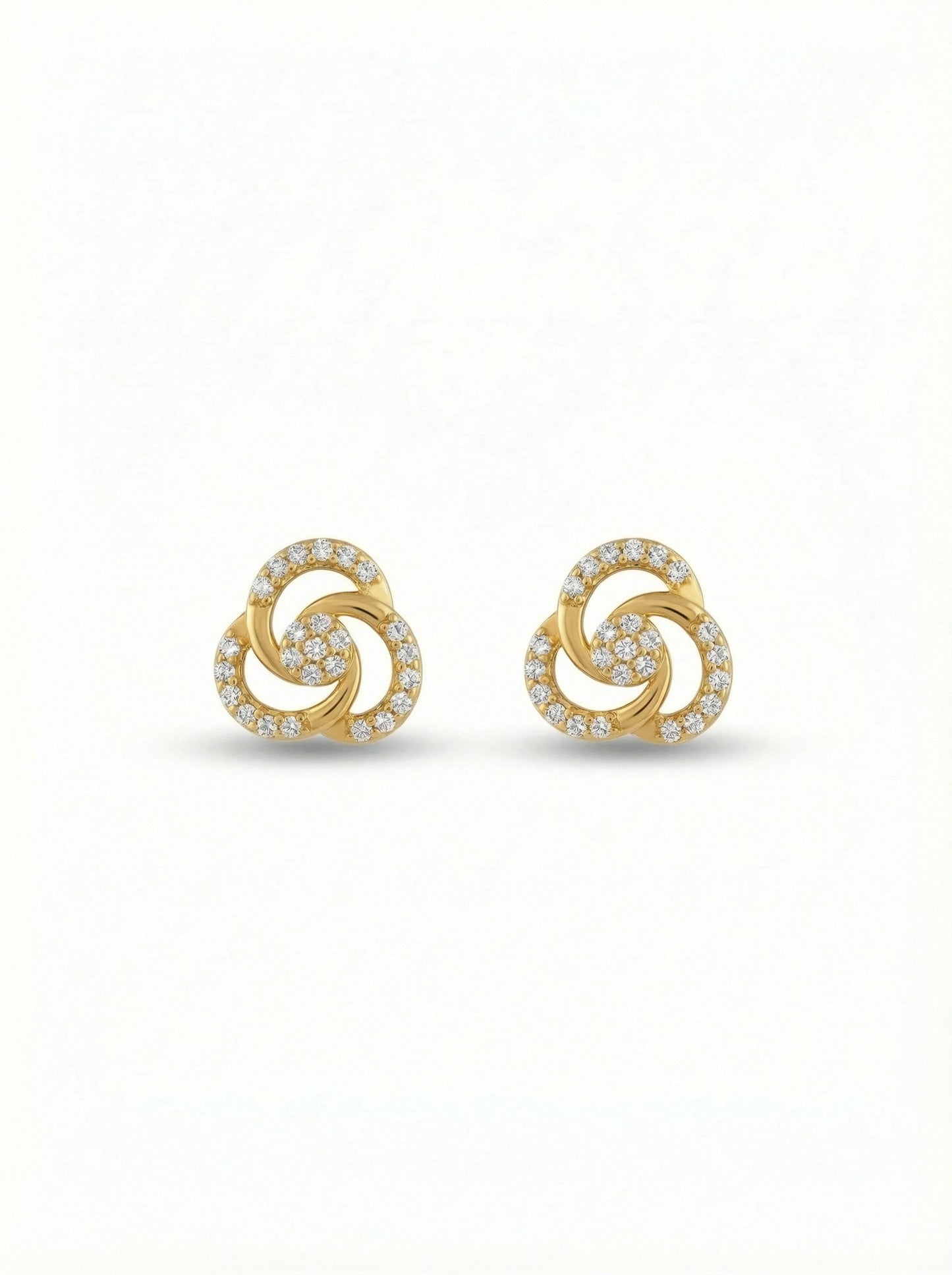 pair of 18k gold plated earrings with a spiral design on a white background