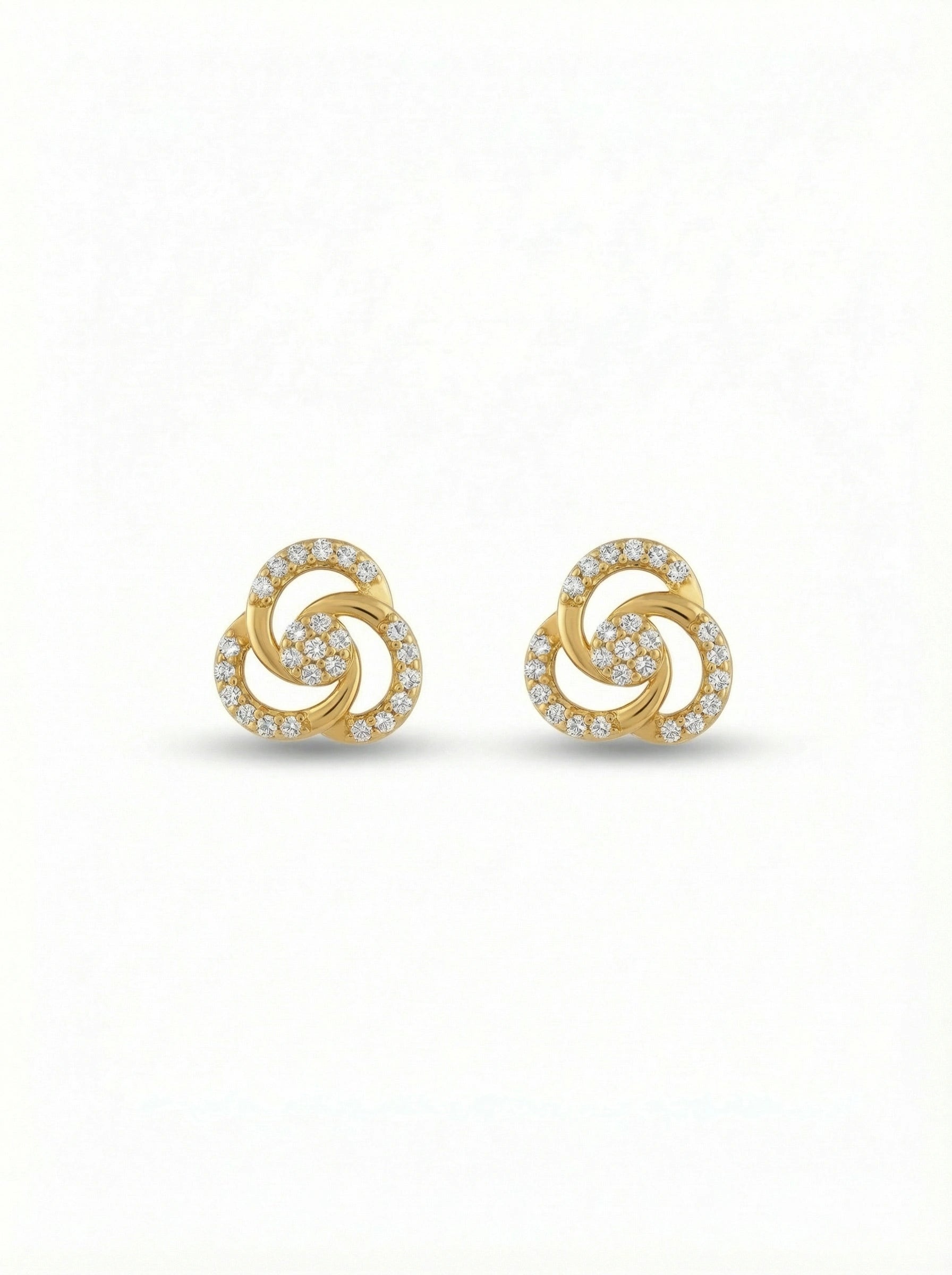 Pair of 18k gold plated earrings with a spiral design on a white background