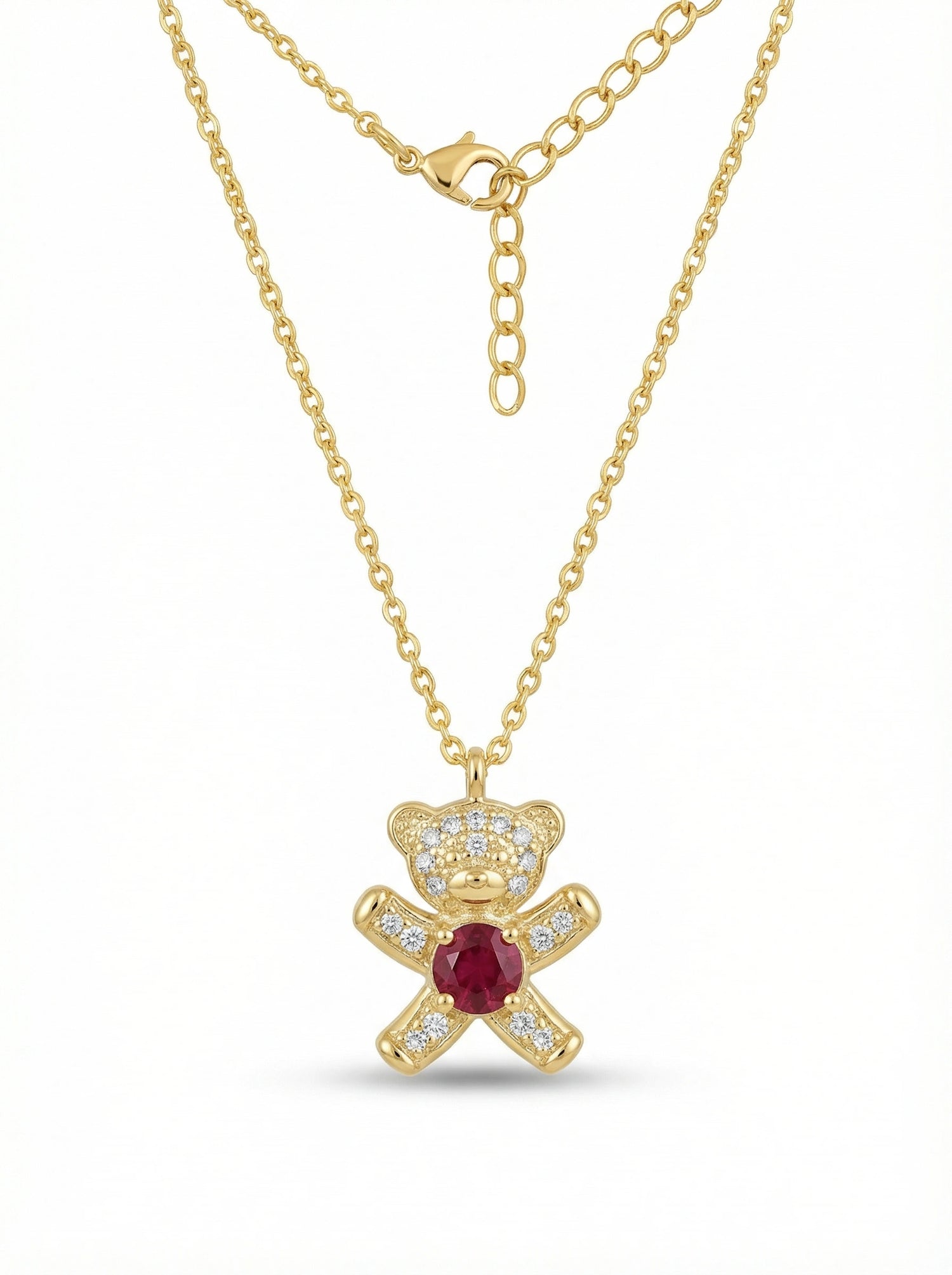 18k Gold plated necklace with a teddy bear pendant featuring a red gemstone on a white background