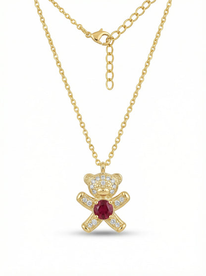 18k Gold plated necklace with a teddy bear pendant featuring a red gemstone on a white background