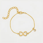 18k Gold  plated bracelet with an infinity symbol on a light gray background
