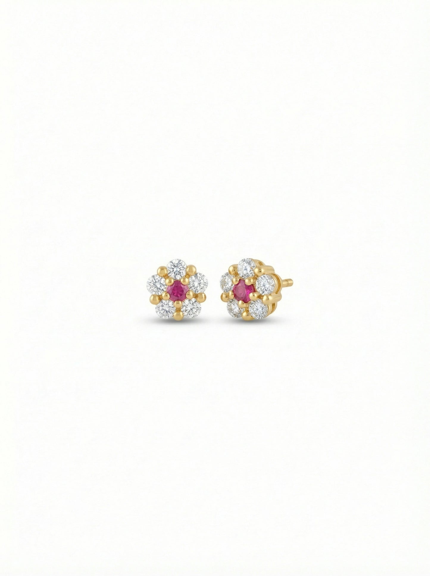 pair of 18k gold plated earrings with ruby stones on a white background