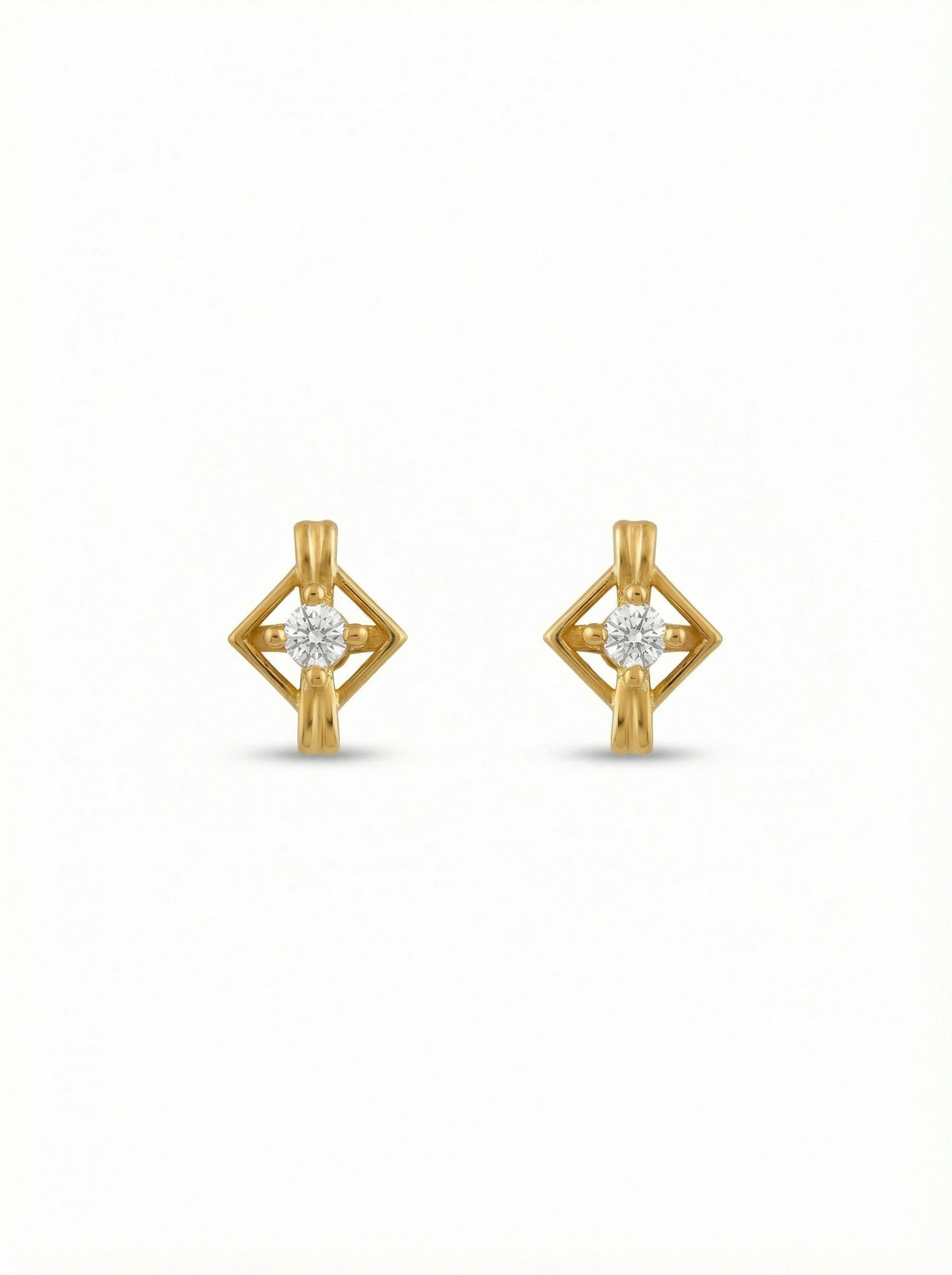 18k Gold plated earrings with diamond-like stones on a white background